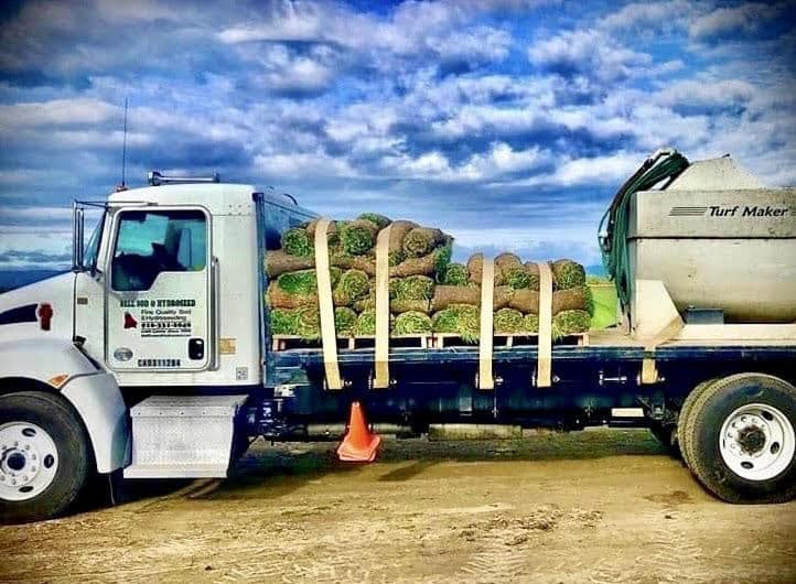 Truck carrying a load of rolled sod